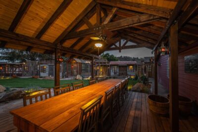 Long table under a covered wood overhang