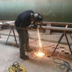 Welding a gate.