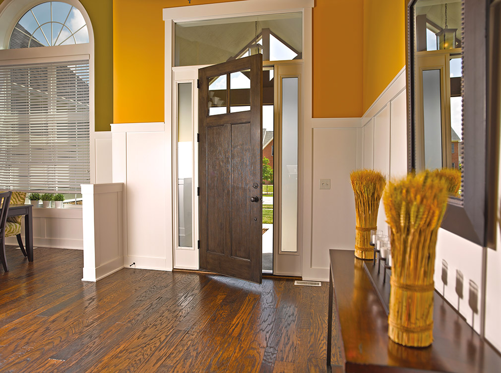 Interior doors leading out of a living room.