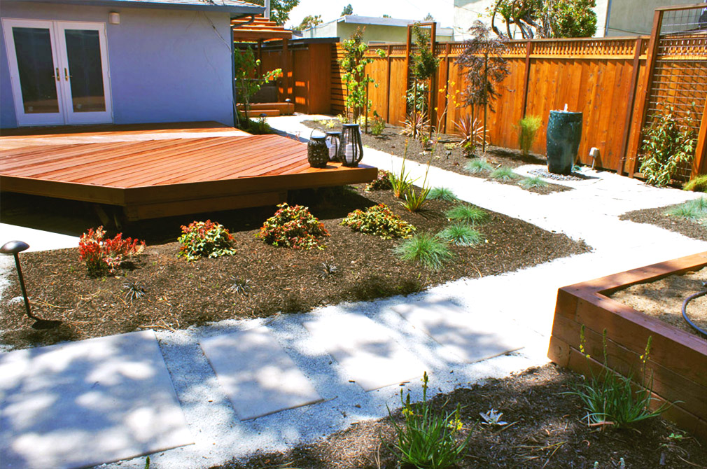 Backyard with new deck, redwood fencing and landscaping.