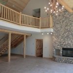 Indoors stone fireplace.