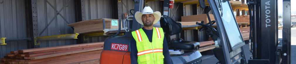 Man in front of fork lift