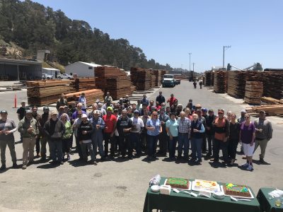 Group photo of men and women employees at big creek lumber