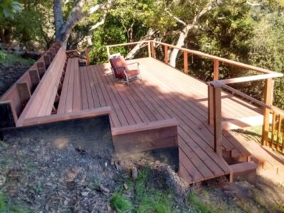 Redwood deck and stairs with a railing