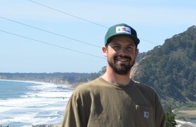 Man standing with the ocean in the background