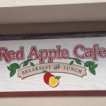 Redwood sign for Red Apple Cafe.