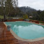 Redwood deck around pool.