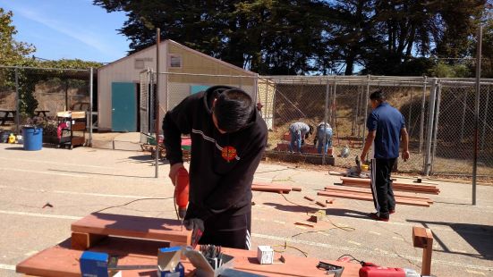 Young man working with woodworking tools.