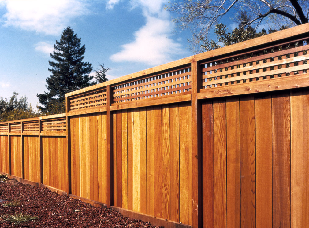 Backyard redwood fence with lattice.